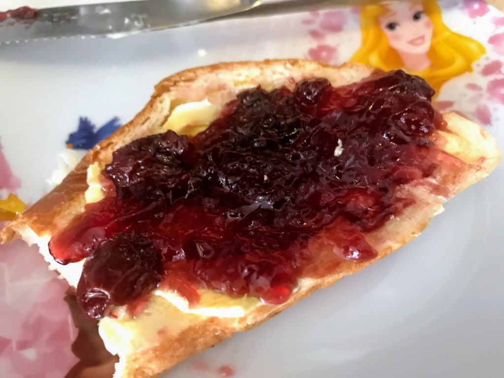 white bread with cherry jam and butter